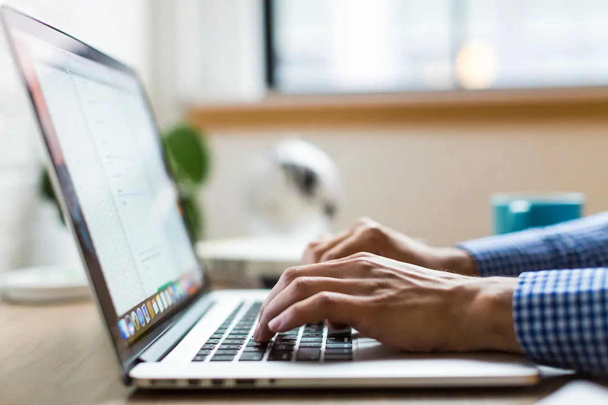 How to deal with burnout: hands on a laptop keyboard
