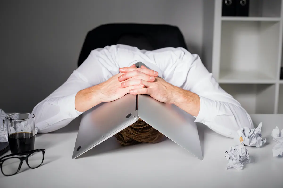 How to solve your COVID-19-induced advertising crisis: man with head on desk