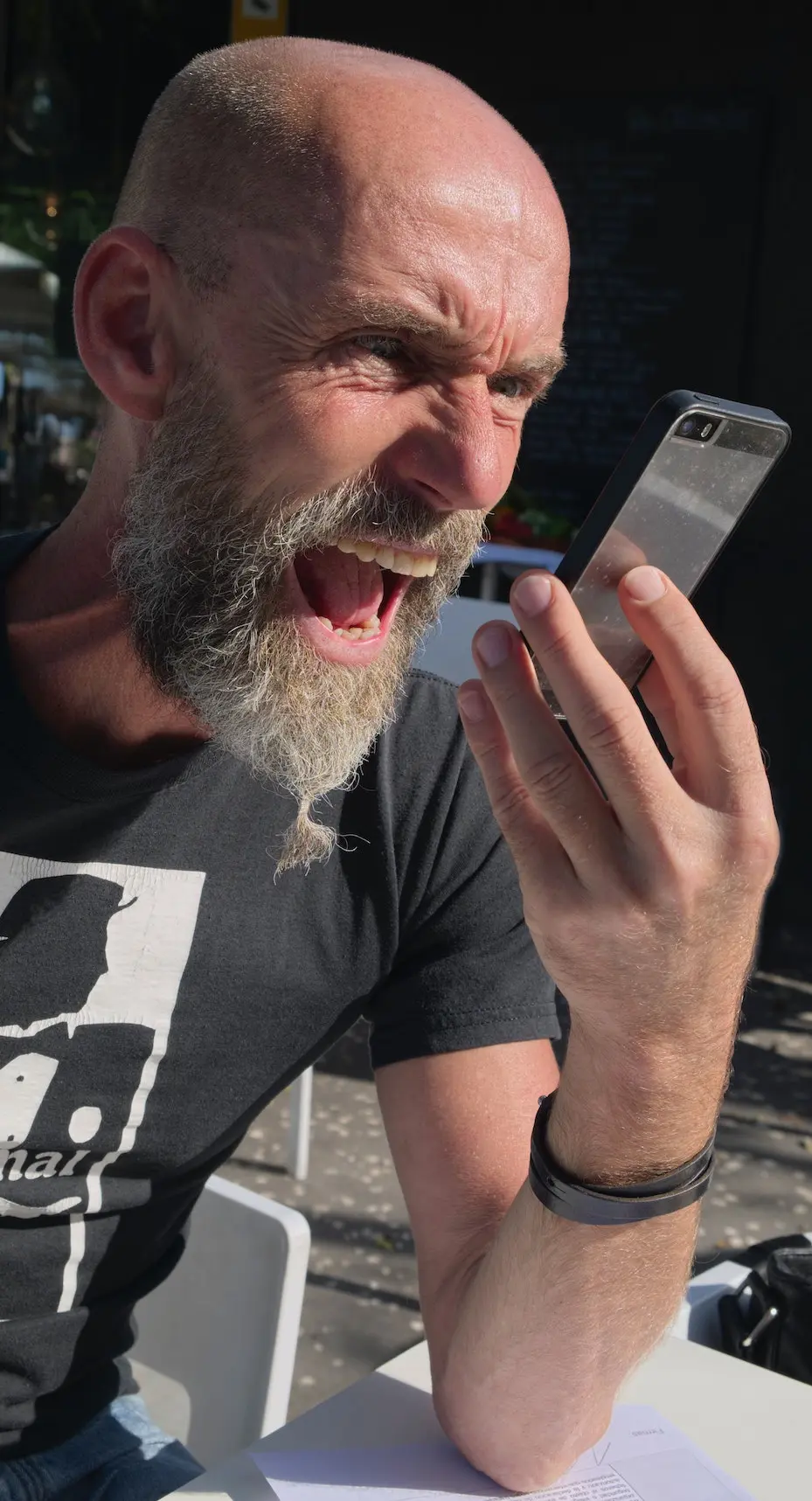 are female voice overs a better choice? Image of man yelling into a cellphone