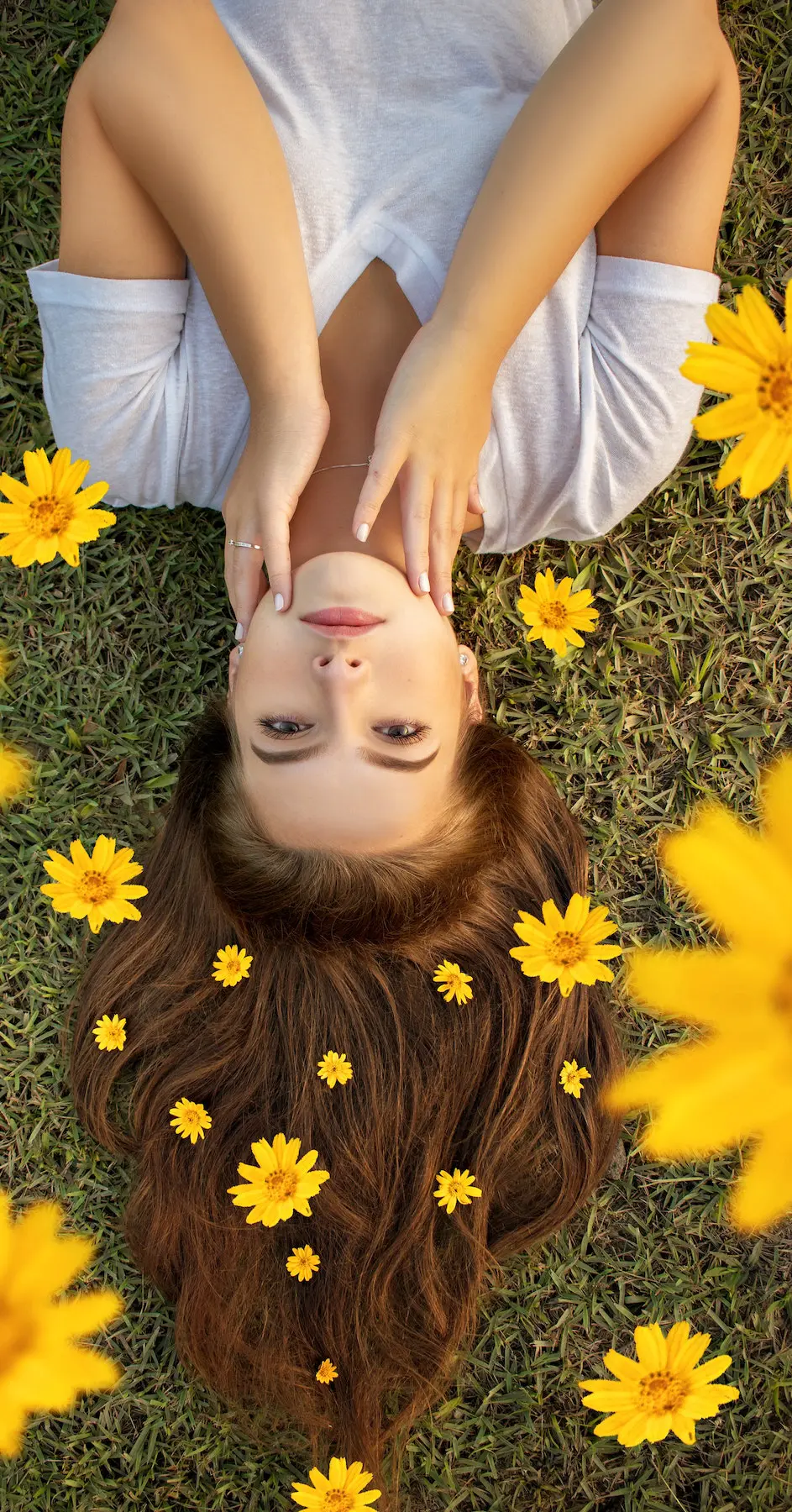 are female voice overs a better choice? Image of woman lying on lawn
