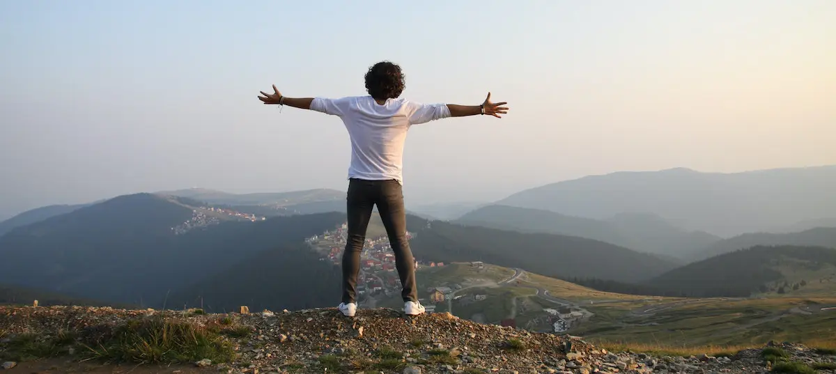 pic of man on hilltop