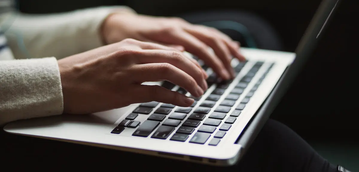 Big Bang in voice over: image of finger typing on a laptop keyboard