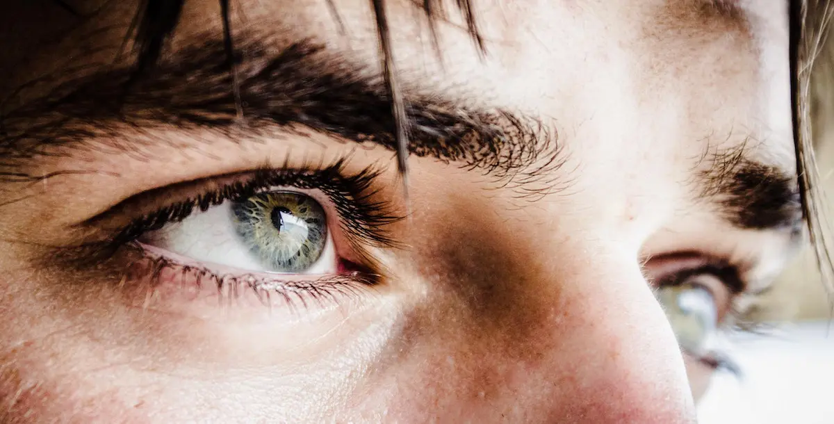 look after your eyes: image of young man staring into the distance