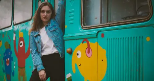 Animation project: image of woman on a train with animated characters painted on the side