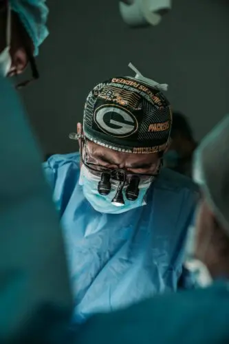Medical narration: image of a surgeon working on a patient