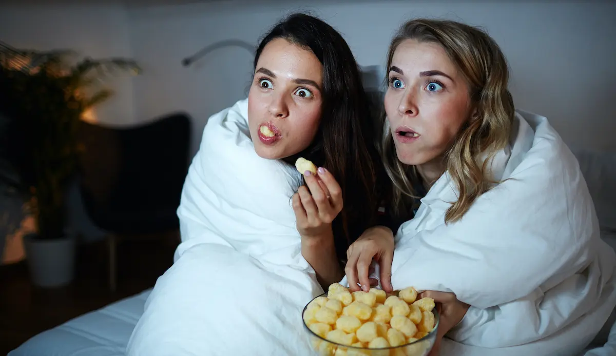 Great storyteller: two women watching a captivating movie