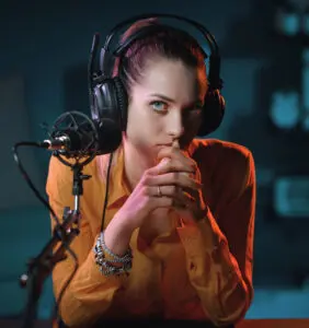 grab your audience: image of female voice actor at the mic