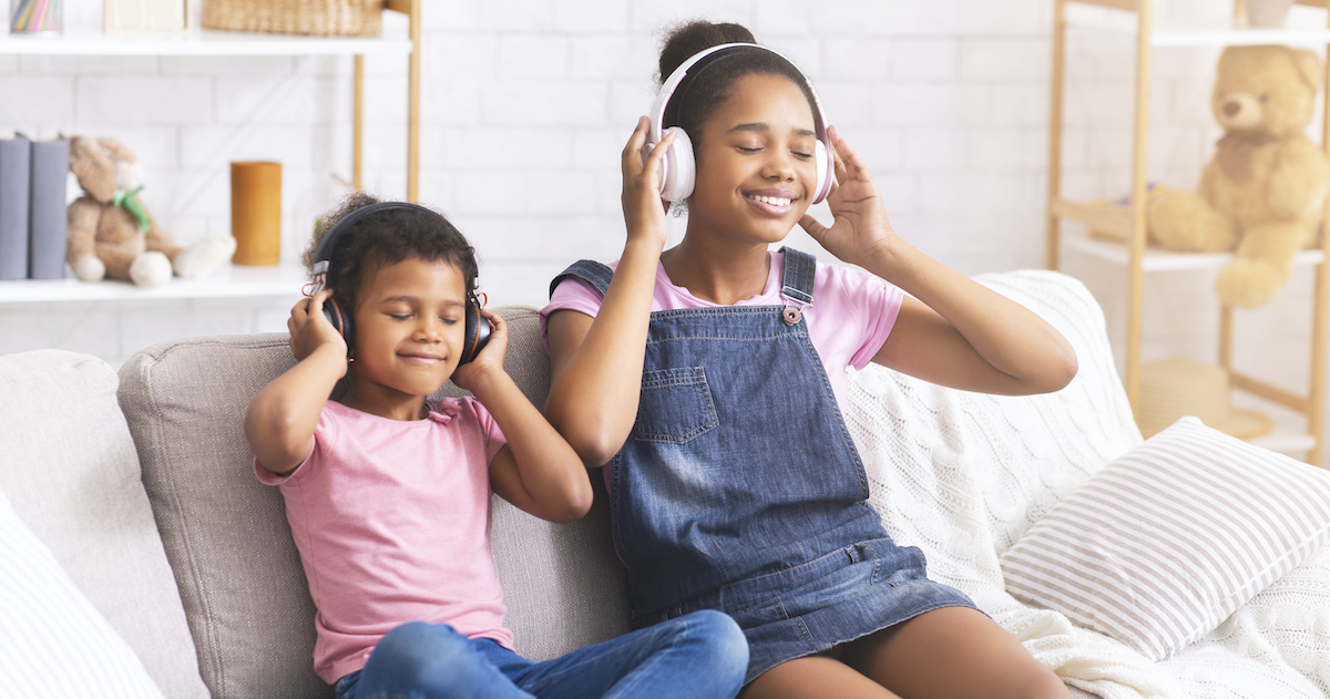 Great sound: two kids listening with headphones