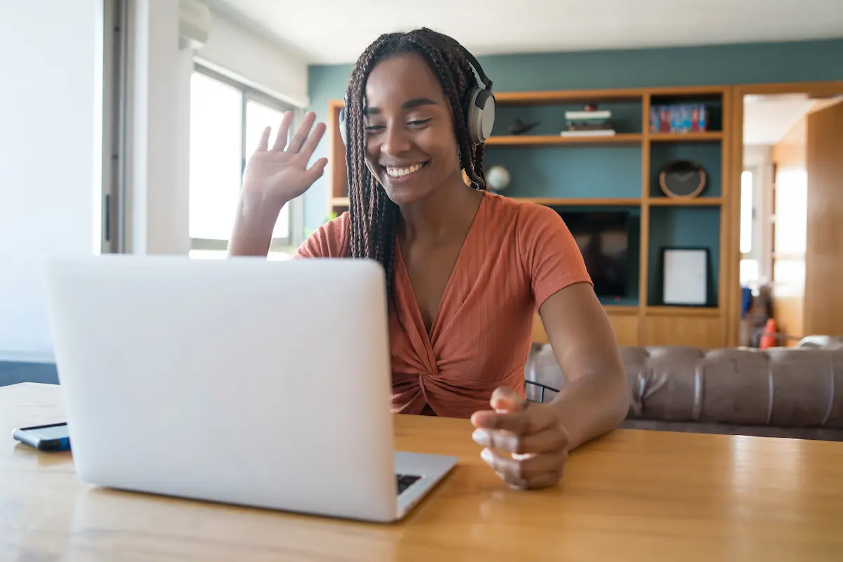 Woman in front of a laptop working from home.