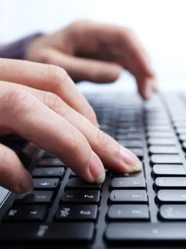 Grabbing your audience's attention: Image of hands typing on a keyboard