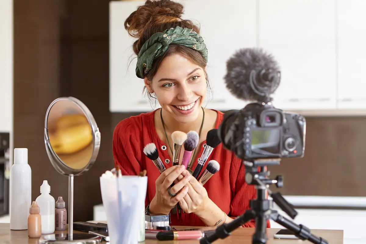 Marketing your business: image of a woman presenting a makeup video in front of a camera