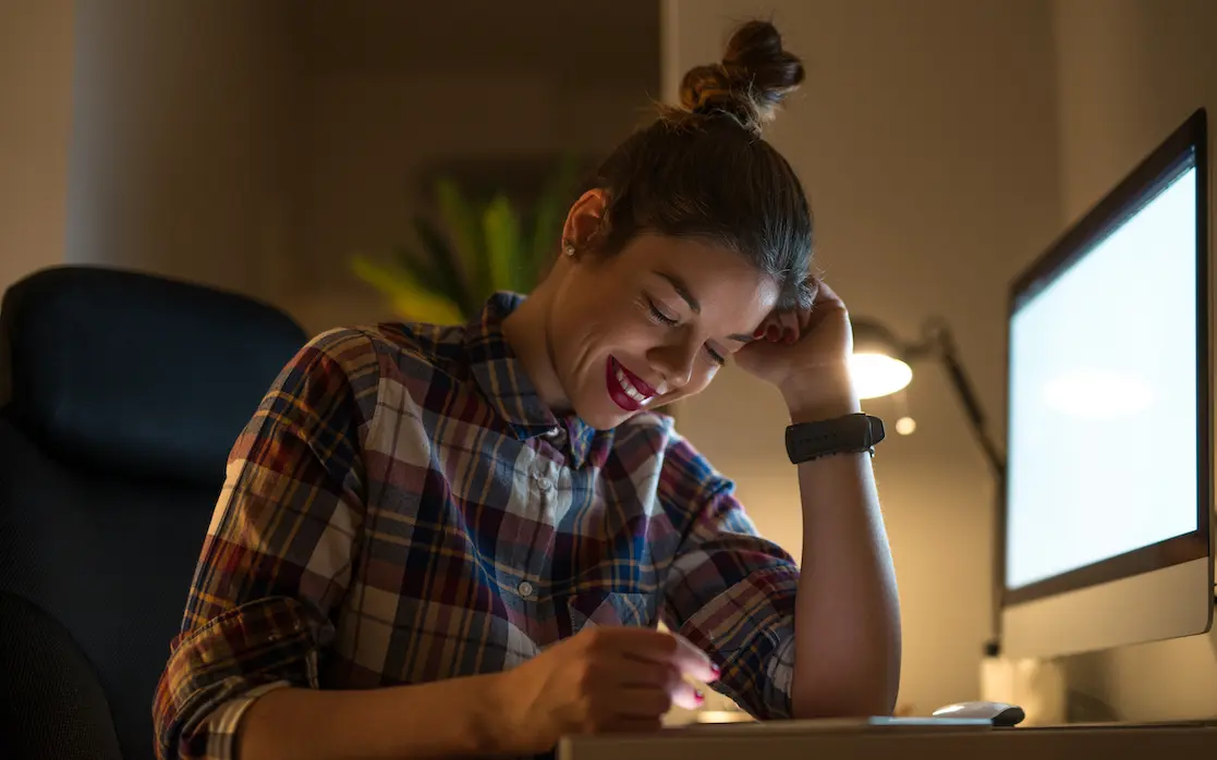 Marketing your business: woman writing a script in front of a computer screen