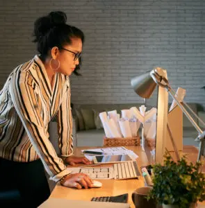 Email marketing: image of a woman standing in front of her desktop computer