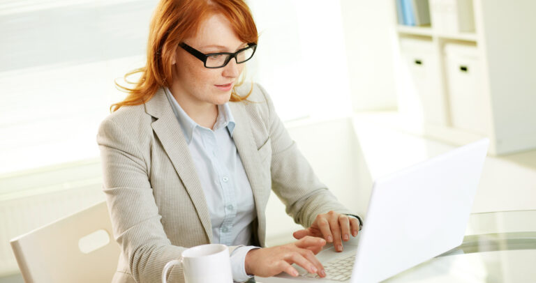 Email marketing: image of a woman writing an email on her laptop