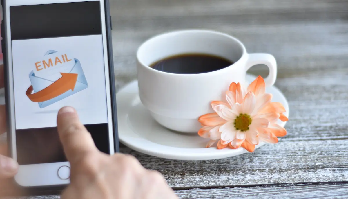 Email marketing: image of a hand pointing at a phone screen