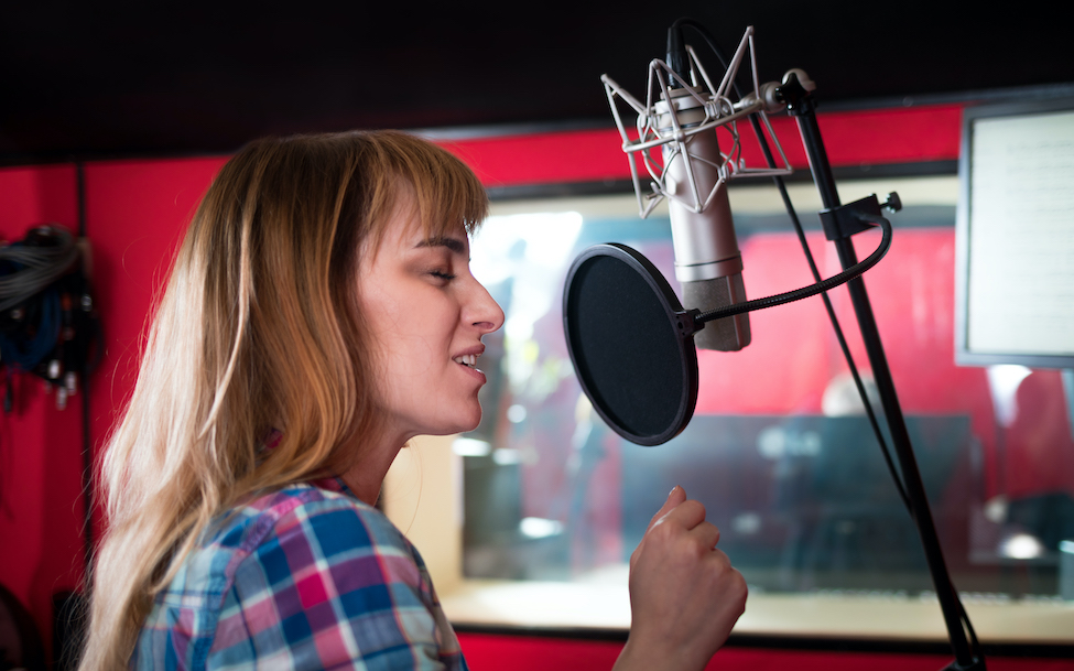 Awesome voice: image of a female voice actor in studio