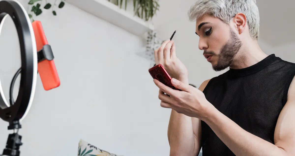 Market your business: image of drag queen doing makeup on TikTok