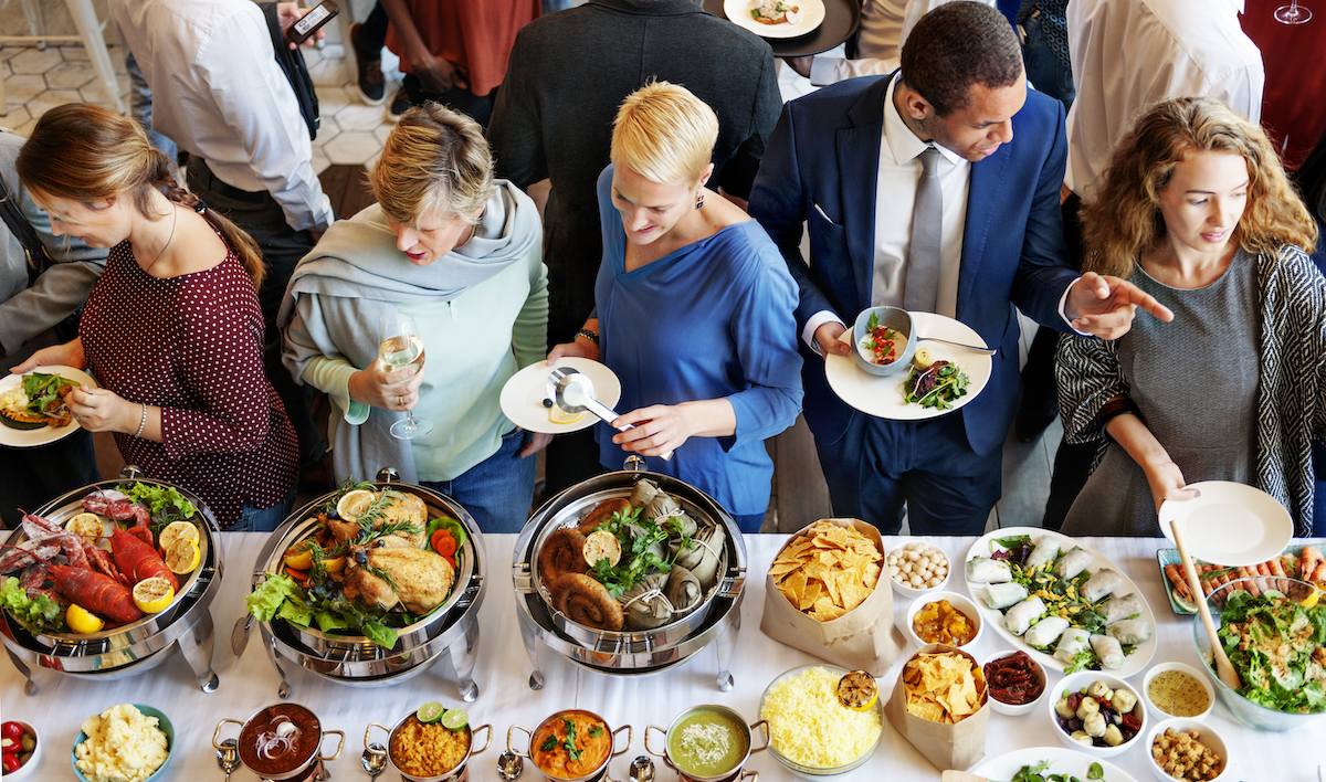 Voice123 profile: image of a group of people in front of a buffet table