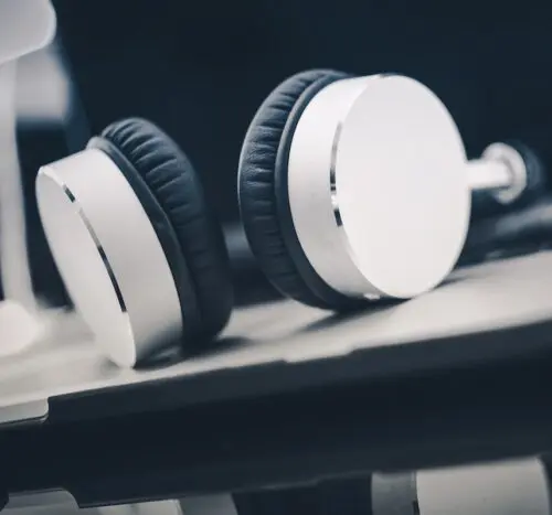 Critical listening: image of a pair of headphones lying on a laptop keyboard