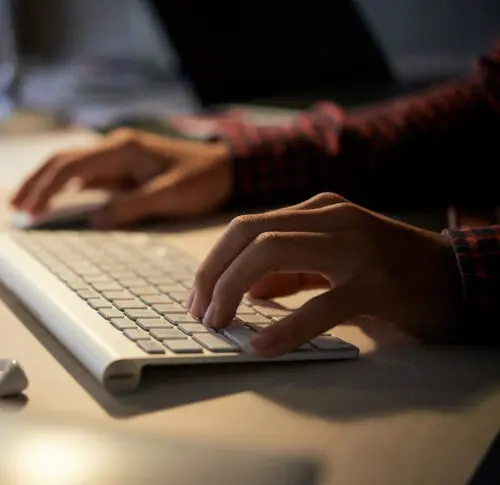 promo scriptwriting: image of a woman's hands on a computer keyboard