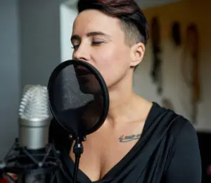 marketing trends: image of a voice actor speaking into a microphone