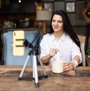 Creator Marketing: image of a young woman making a marketing video in her kitchen