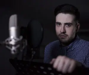 Voice123: image of a voice actor standing at the mic