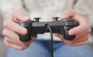 Halo: image of a girl's hands clasping a videogame controller