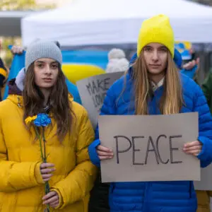 take advantage of the times: image of two young Ukrainians protesting for peace