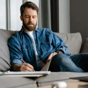 Writing advertising copy: image of a young advertising executive writing advertising copy