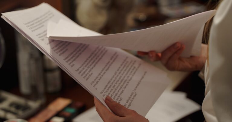 narration scripts: image of a person paging through a script