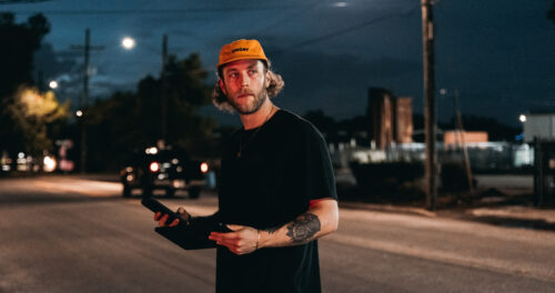 Documentary producer: image of a documentary producer watching a shoot in progress